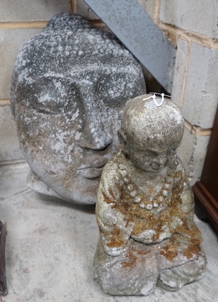 A reconstituted stone Buddha mask garden ornament, height 50cm, together with a seated Buddha garden ornament